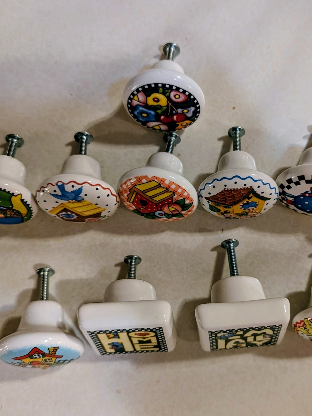 Vintage Mary Engelbreit Ceramic Knobs with Colorful Folk Art Designs.